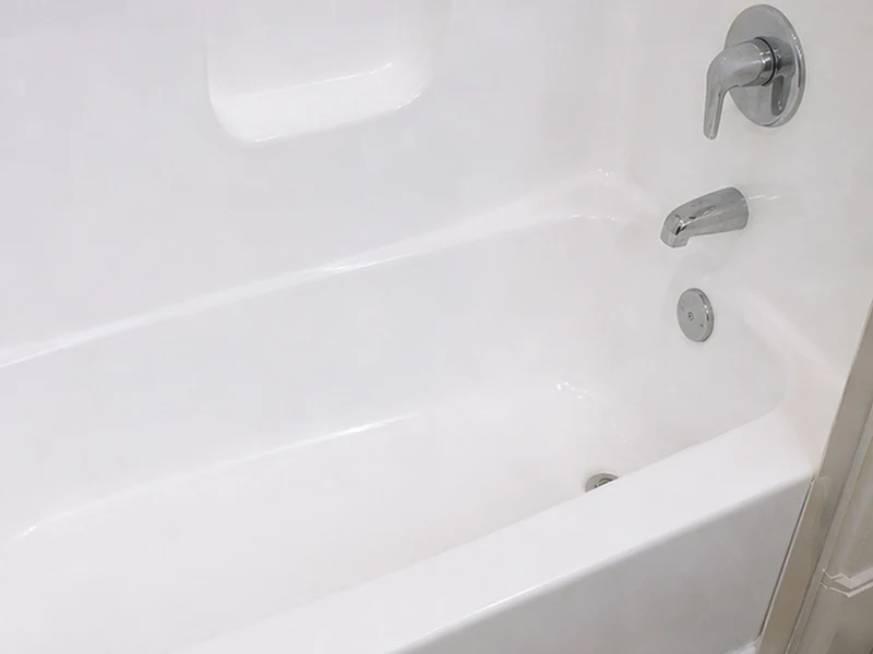 Refinished fiberglass tub with even bright-white gloss in a Lawrence Station condo, Santa Clara